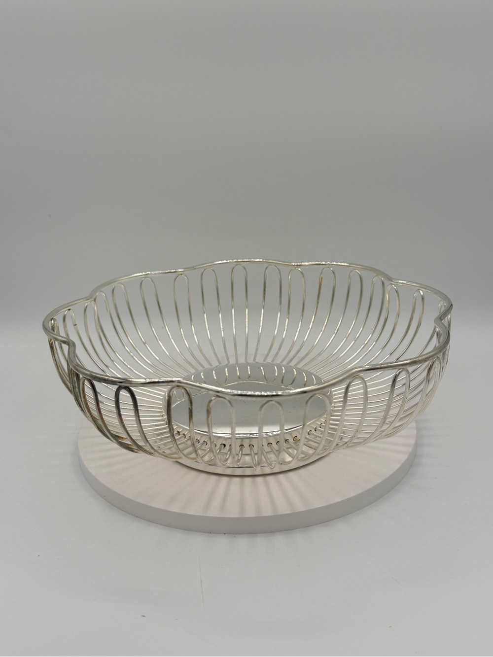 Godinger silver-plated wirework basket with a scalloped edge